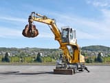 2008 Liebherr A316 wheel excavator, side view with grapple attachment