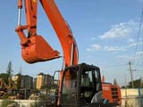 Hitachi ZX210 crawler excavator, side view
