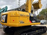 2023 Caterpillar 323D2L crawler excavator, rear three-quarter view