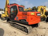 2023 Doosan DX140LC-9C crawler excavator, rear three-quarter view