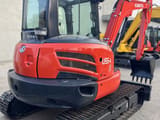 2022 Kubota U55-4 mini excavator, rear three-quarter view