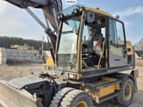 2014 Volvo EW160D wheel excavator cab and front view