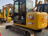 2025 Caterpillar 306E2 mini excavator, rear three-quarter view