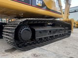 Caterpillar 330BL crawler excavator side view of tracks