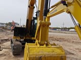 Komatsu excavator, close-up view of bucket and arm