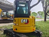 2024 Caterpillar 303.5E mini excavator, rear view