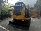 2024 Caterpillar 306E2 mini excavator rear view with engine compartment open