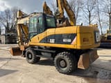 2008 Caterpillar M318D wheel excavator, rear three-quarter view