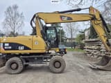 2010 Caterpillar M318D wheel excavator, side view