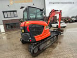 2023 Kubota KX060-5 mini excavator, rear three-quarter view