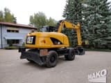 2012 Caterpillar M313D wheel excavator, rear three-quarter view