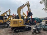 2024 Caterpillar 307E excavator, rear three-quarter view