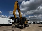2005 Caterpillar M322C MH material handler, front three-quarter view