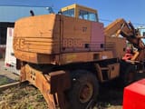 1994 CASE 888BP wheel excavator, rear three-quarter view