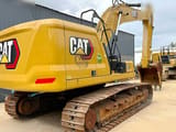 2023 Caterpillar 320 crawler excavator, rear three-quarter view