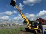 2017 Komatsu PC118MR-8 mini excavator, side view with boom raised