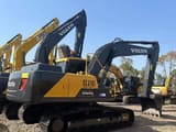 2022 Volvo EC210 Heavy Duty crawler excavator, rear three-quarter view