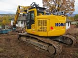 2022 Komatsu PC228USLC-11 crawler excavator, rear three-quarter view