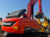 2024 Doosan DX225LCA mini excavator, rear three-quarter view