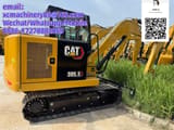 2026 Caterpillar 305.5 mini excavator, rear three-quarter view