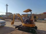 2022 Caterpillar 303 CR mini excavator, rear three-quarter view