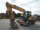 2003 Caterpillar M313C wheel excavator, front three-quarter view