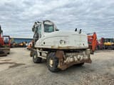 2009 Caterpillar M316D wheel excavator, rear three-quarter view