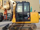 2023 Caterpillar 305.5E mini excavator, side profile view