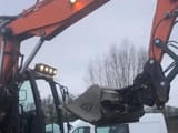 2019 Doosan DX140W-5 wheel excavator, side view of boom and cab