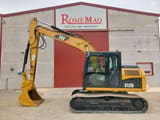 2010 Caterpillar 312D crawler excavator, side view