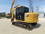 2023 Caterpillar 307E2 excavator, rear three-quarter view