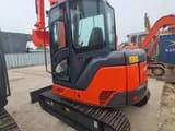 2023 Hitachi ZX60U mini excavator, rear three-quarter view