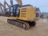 2018 Caterpillar 323F LN crawler excavator, rear three-quarter view
