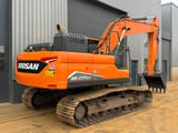 2022 Doosan DX225LC-7 crawler excavator, rear three-quarter view