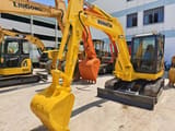 2019 Komatsu PC58 mini excavator, front three-quarter view
