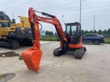2023 Kubota U55-4 mini excavator, front three-quarter view