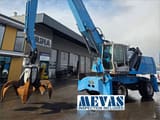 2011 Fuchs MHL360 D material handler, side profile view