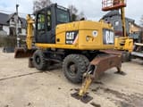 2010 Caterpillar M313D wheel excavator, rear three-quarter view