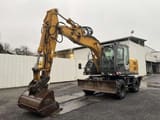 2010 Hitachi ZX140W-3 wheel excavator, front three-quarter view