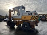 1982 Poclain P60 wheel excavator, rear three-quarter view