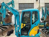 Kubota U25 mini excavator, side view