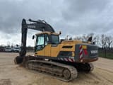 2012 Volvo EC220DL crawler excavator, rear three-quarter view