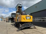 2018 Caterpillar MH3024 material handler, rear three-quarter view