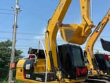 2024 Caterpillar 312D mini excavator, rear three-quarter view