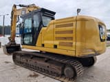 2018 Caterpillar 323GC crawler excavator, rear three-quarter view