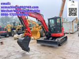 2024 Kubota KX057-4 mini excavator, front three-quarter view