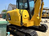 2023 Komatsu PC56-7 crawler excavator, rear three-quarter view
