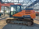 Doosan DX140LC-5 crawler excavator, side view