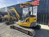 2014 Komatsu PC55MR-3 mini excavator, rear three-quarter view