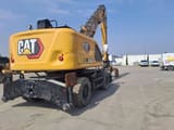 2024 Caterpillar MH3024 wheel excavator, rear three-quarter view
